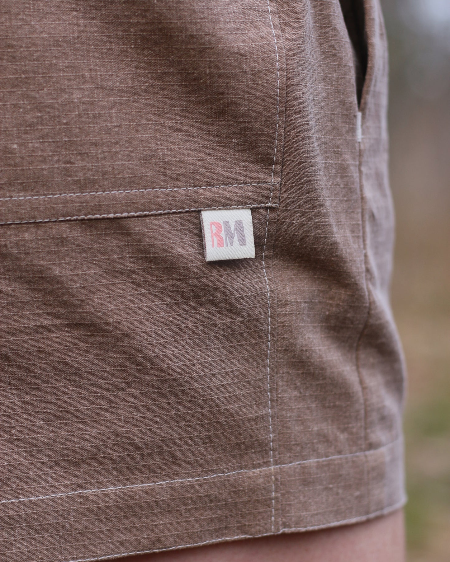 Brown shorts with brand label